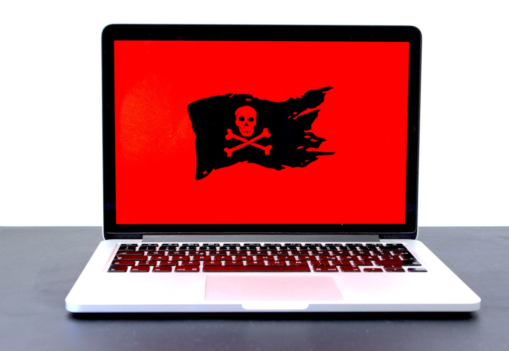 Laptop displaying malware warning signs requiring professional virus removal in Brooklyn, NY